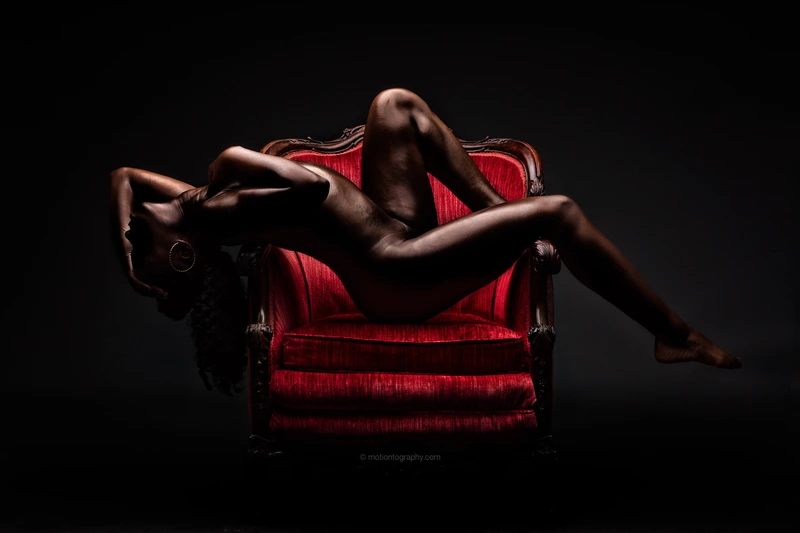 boudoir photography nude woman red chair by Motiontography