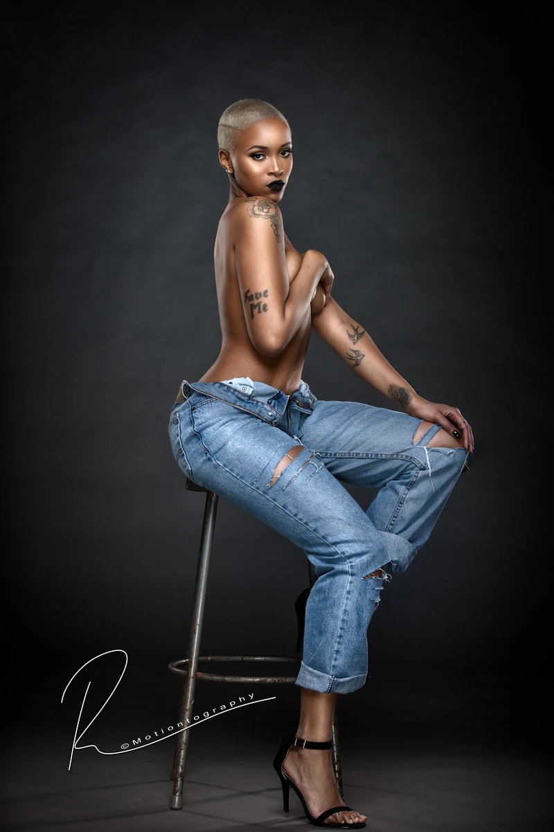 boudoir photography tattooed woman ripped jeans by Motiontography