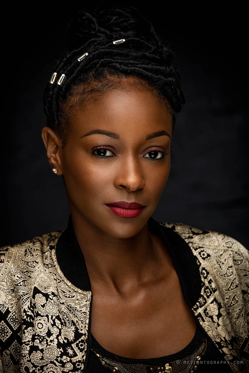 Professional studio headshot with braided hairstyle by Motiontography