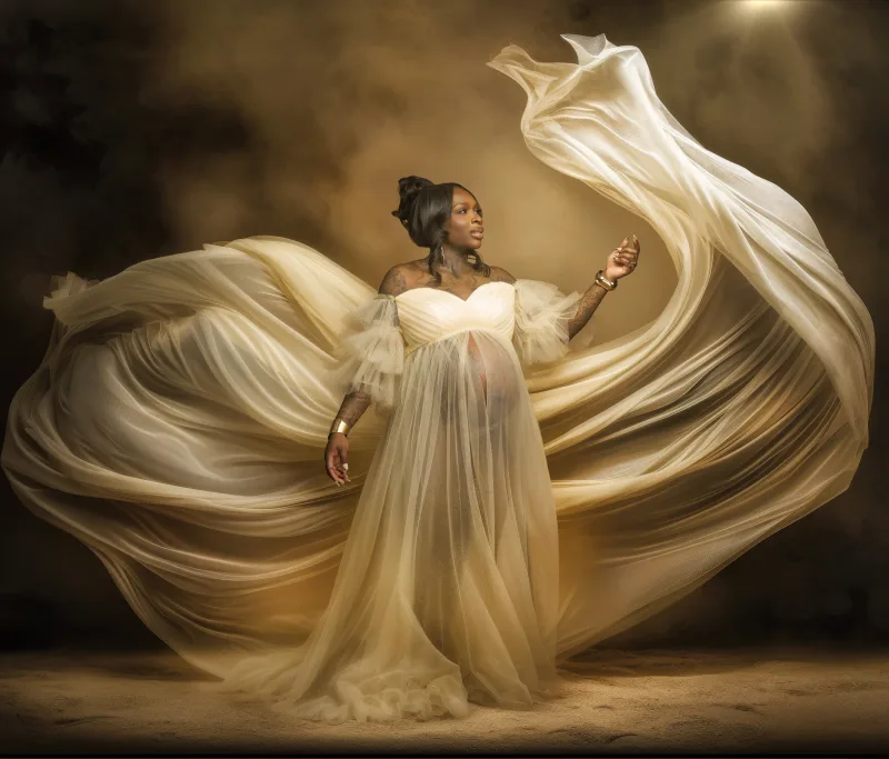 Golden flowing-tulle fine-art maternity portrait by Motiontography