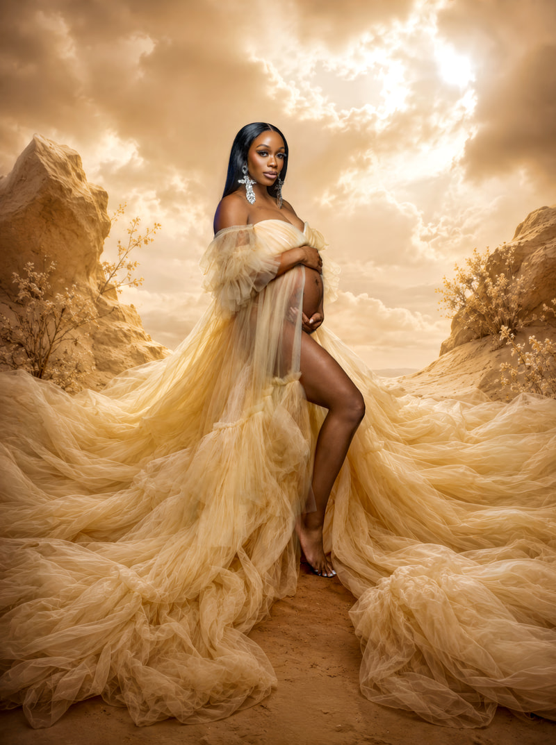 Full-length portrait of a person wearing a long flowing sheer gown, standing barefoot on textured ground and cradling a visible rounded abdomen against a rocky.