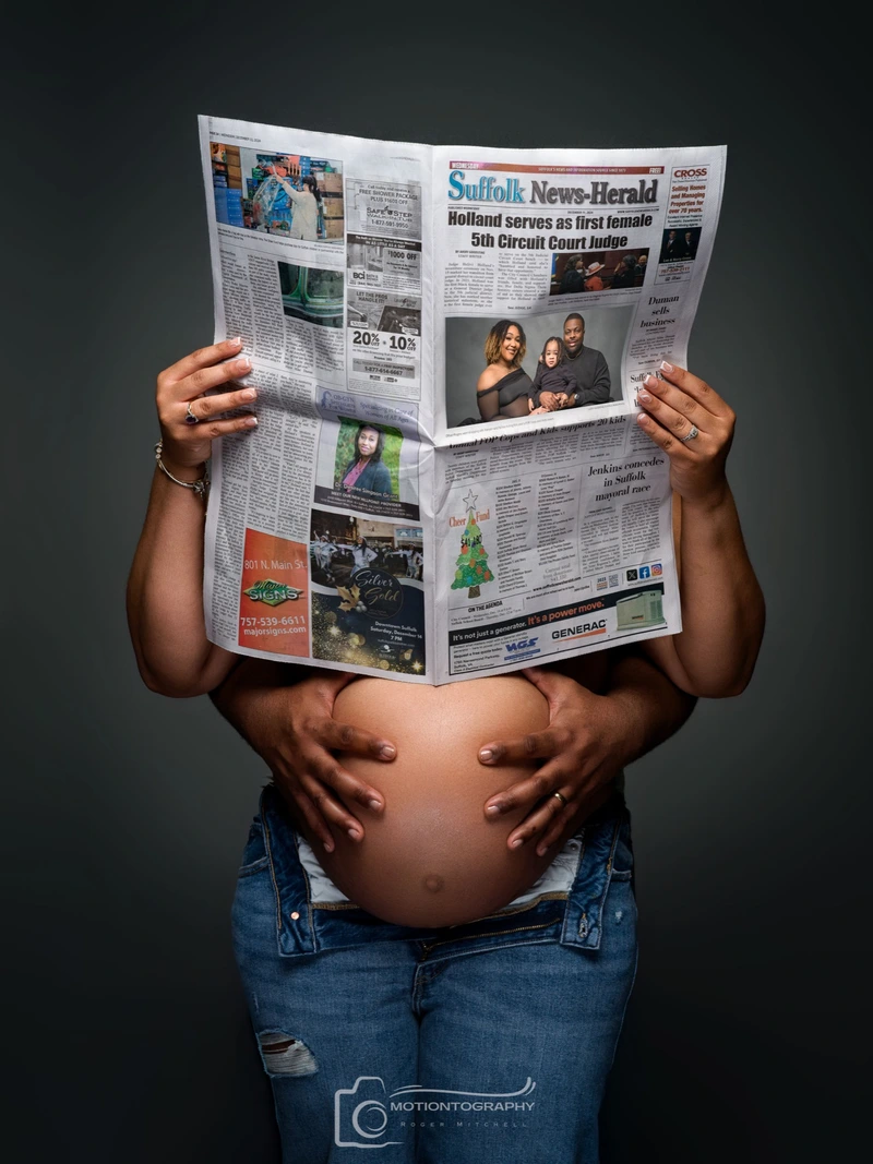 pregnancy creative newspaper photo concept by Motiontography