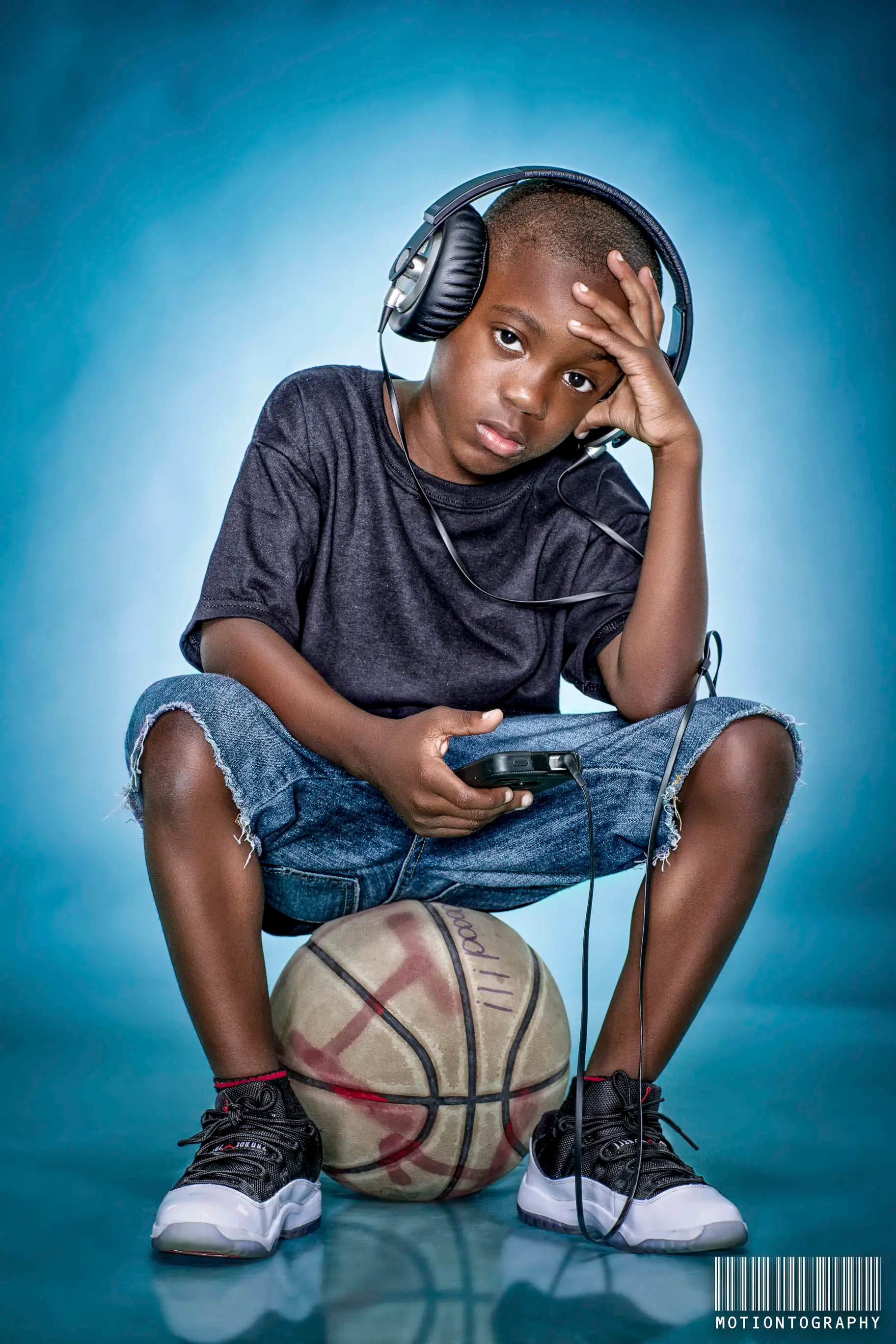 boy headphones basketball portrait by Motiontography